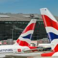 London, England, UK - 20 May 2025: Tail fins of British Airways jets in front of Terminal 5 at London Heathrow Airport
