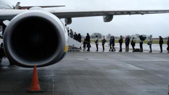Passengers boarding a Ryanair plane at Bristol Airport.