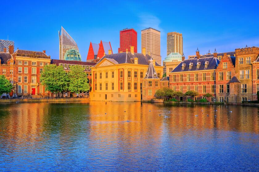 The Hague, Netherlands.  Downtown Skyline and Parliament Buildings at sunset.