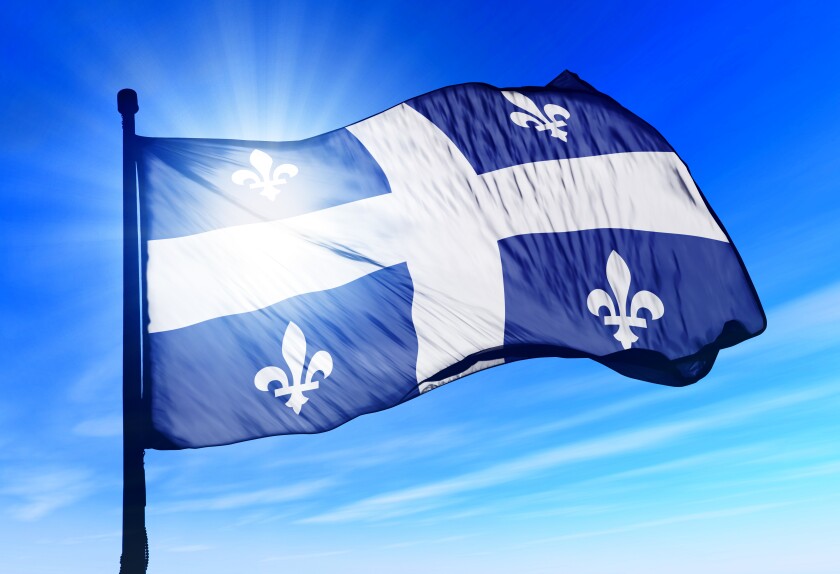 Quebec (Canada) flag waving on the wind