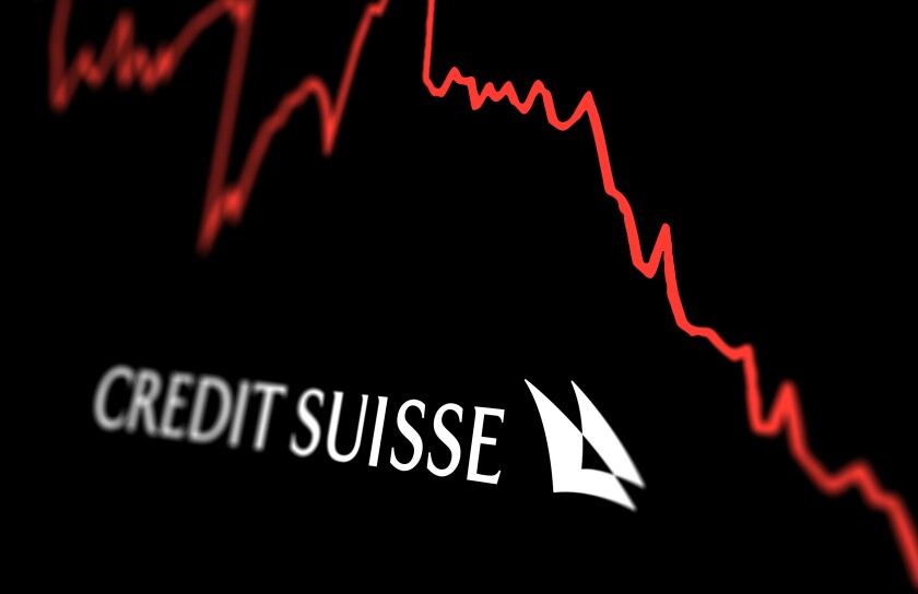 White Credit Suisse logo on a stock market performance chart tre