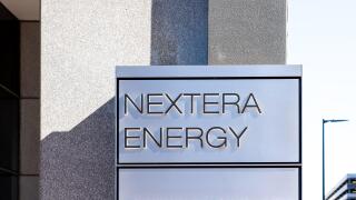 Houston, Texas, USA - February 27, 2022: NextEra Energy sign is seen at its office building in Houston, Texas, USA.