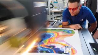 Chemnitz, Germany. 09th May, 2022. A printer dyes a textile surface at the Saxon Textile Research Institute. The institution is celebrating its 30th anniversary. Credit: Sebastian Willnow/dpa/Alamy Live News