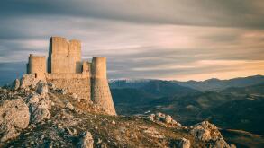 The rolling hills of the Apennines mountain range as seen from Rocca Calascio, featuring Santa Maria della Pieta.

abandonedabruzzoadventureafternoona