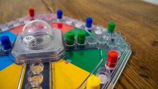 Durham, UK - 5 April 2020: Frustration (also known as Trouble and  Kimble) is a family fun board game  in which players compete to be the first to sen