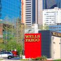 Wells Fargo branch in downtown Dallas, Texas with skyscrapers and office buildings in the background.