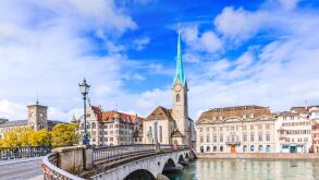 Zurich, Switzerland. View of the historic city center with famous Fraumunster Church, on the Limmat river.