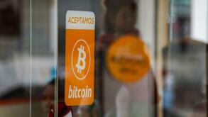 A bitcoin acceptance sign seen in San Salvador. The Bukele administration has ended its fourth year in office ahead of a questioned reelection bid. The country has been placed under an ongoing state of emergency to combat gangs that has been in place for 
