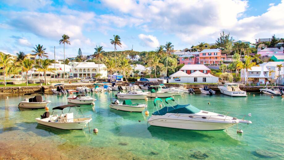 Boats moored in the clear turquoise waters of Flatt's Inlet, Hamilton Parish, Bermuda, Atlantic, Central America