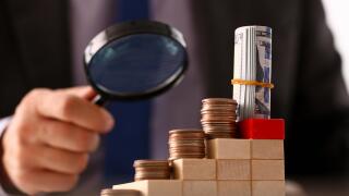 Hand businessman in suit hold quarter