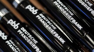 Pens printed with the writing 'Deutsche Pfandbriefbank' are seen during the financial statements press conference of Hypo Real Estate (HRE) in Munich, Germany, 01 March 2012. The commercial property lender presented its balance sheets of 2011. Photo: FRAN