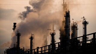 Oil and gas refinery smokestacks