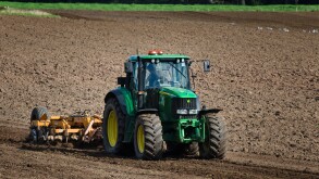 Tractor cultivating a field