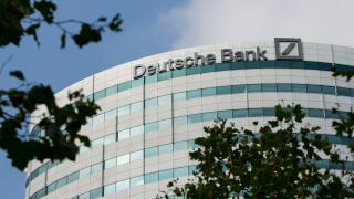 A logo sign outside of an office building occupied by Deutsche Bank in Amsterdam, Netherlands on October 4, 2015.