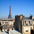 Eiffel Tower across roof tops in Paris, France