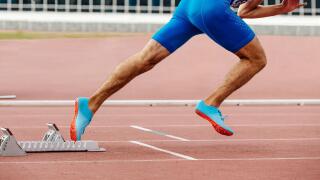 male runner start sprint running with starting blocks