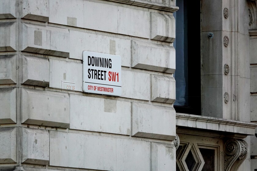 Closeup of the Downing Street sign in Westminster, London, UK.