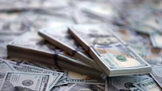 Very big amount of US hundred dollar bills close up. Huge quantity of united states currency notes on flat table