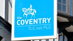 Sign above "The Coventry Building Society" branch premises in Stratford upon Avon includes slogan "TLC not PLC" and Lady Godiva