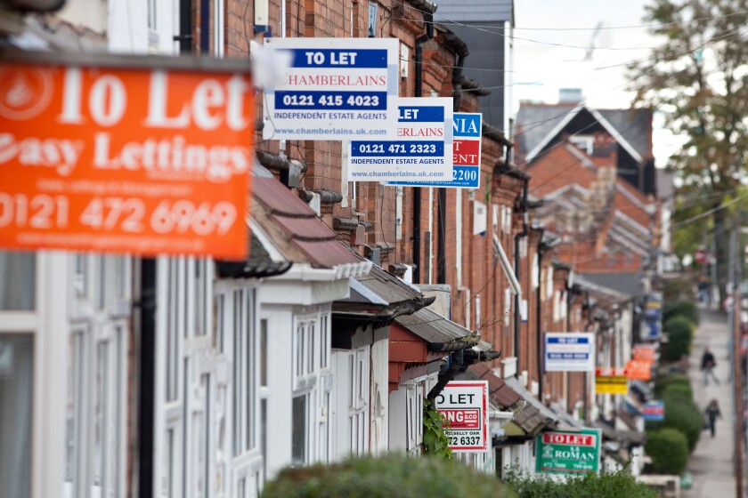 House for sale signs and to let signs on terraced homes in the Selly Oak area of Birmingham, England, UK