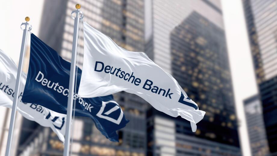 Berlin, DE, March 2023: Flags of Deutsche Bank waving in the wind in a financial district. On march 2023 Deutsche Bank suffered a stock market crash.