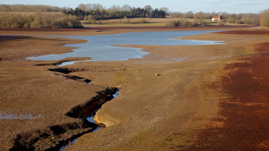 Bewl reservoir in drought conditions with very low water level