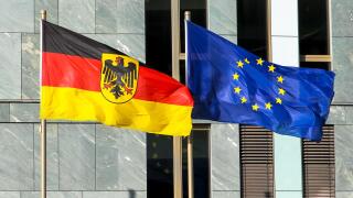 Flags of Germany (Federal Republic of Germany; in German: Bundesrepublik Deutschland) and the European Union (EU) waving in the wind.