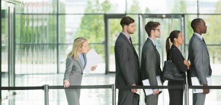 Business people waiting in line