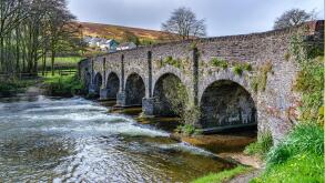 Six arched bridge over the River Barle as it flows through the village of Withypool in Exmoor National Park Somerset UK