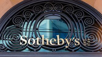 Sign and logo at the entrance to the Sotheby's building in Geneva. Sotheby's is a multinational company specializing in fine art and luxury objects
