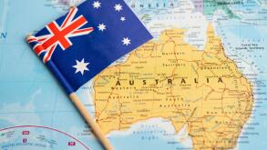 Bangkok, Thailand - February 7, 2021 Australia flag on world map background.