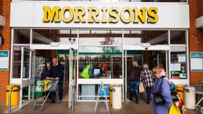 Customers entering and leaving a Morrisons Supermarket.