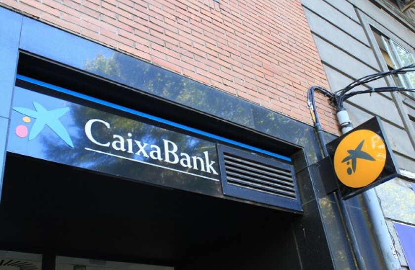 CaixaBank branch in Madrid (Spain). Caixabank and Bankia merge, creating the largest bank in Spain. / Ana Bornay