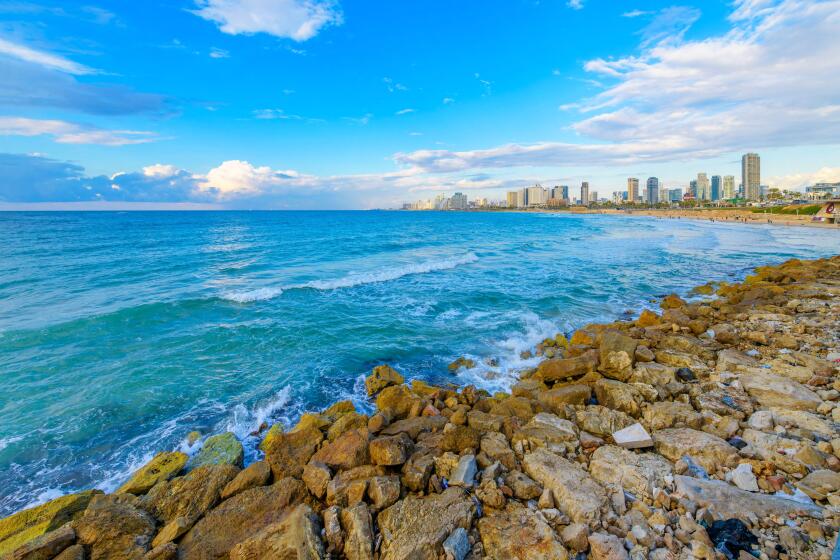 View of the coastal city skyline and beaches of Tel Aviv, Israel, from the ancient city of Jaffa, along the Mediterranean Sea.