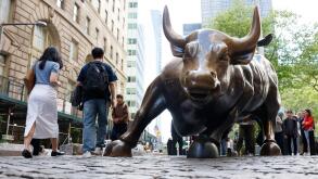 New York, United States. 07th May, 2025. Pedestrians walk near the Charging Bull Bronze Sculpture on Broadway near the New York Stock Exchange on Wall Street on Wednesday, May 7, 2025 in New York City. Stocks moved slightly higher Wednesday with the Feder