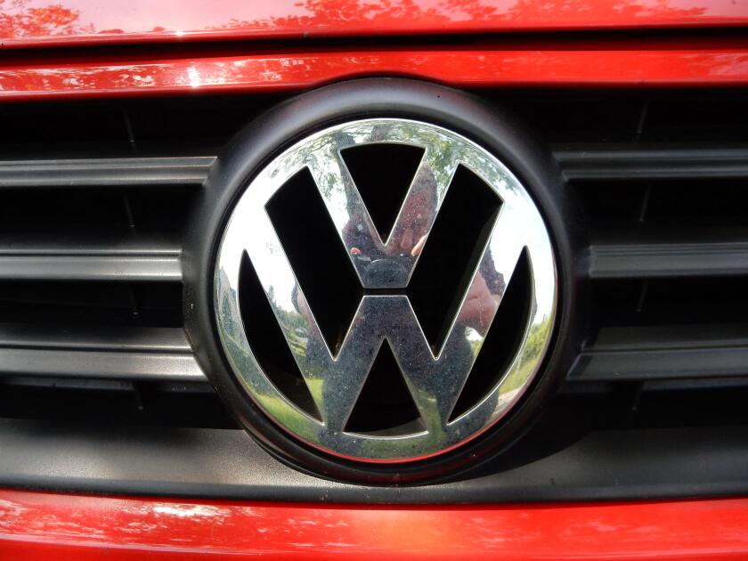 VW Logo on a red Volkswagen car