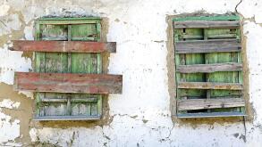 two old boarded-up window on the wall. Image shot 10/2019. Exact date unknown.