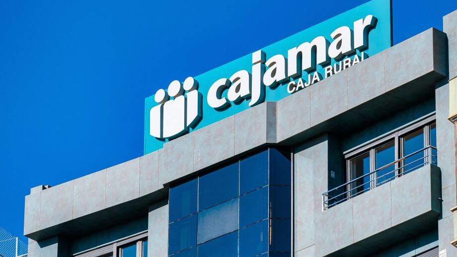 Alicante, Spain, logo or business sign of Cajamar on top of a building. The company offers financial services.