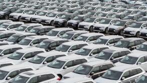 Row of new cars for sale in port