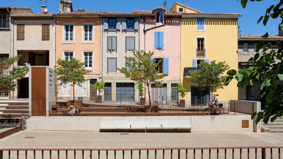 Colourful French houses beside the Cathedral Saint - Michel in Carcassonne, France.