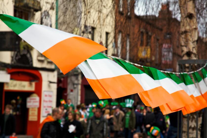 Dublin, Ireland; Flags Of Ireland Hanging Over The Street