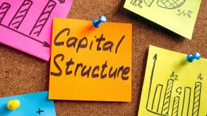Capital structure memo pinned on the board in the office.