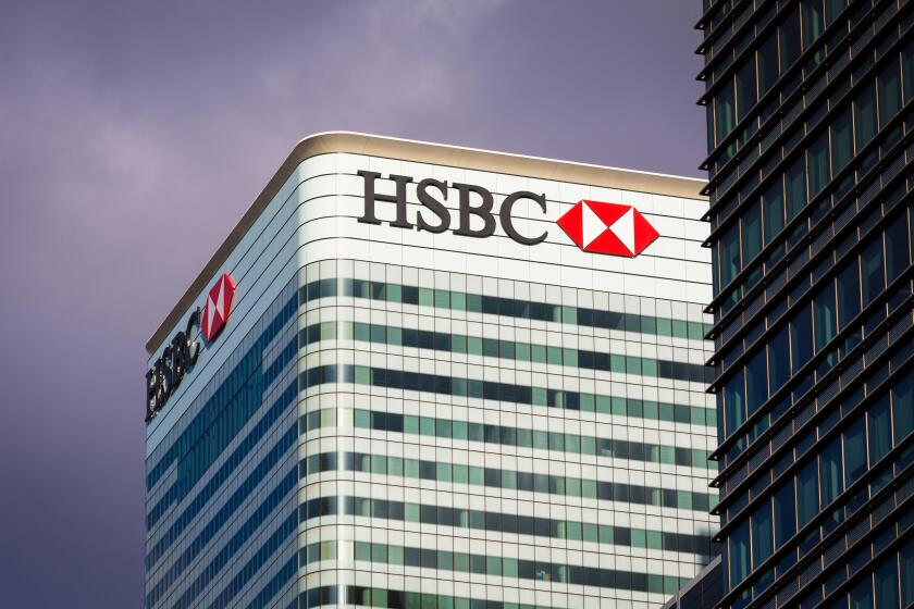 HSBC Bank headquarters building on stormy day in Canary Wharf, Docklands, London, England, UK