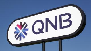 Aarhus, Denmark - March 30, 2018: QNB logo on a panel. QNB, Qatar National Bank is a Qatari commercial bank headquartered in Doha, Qatar