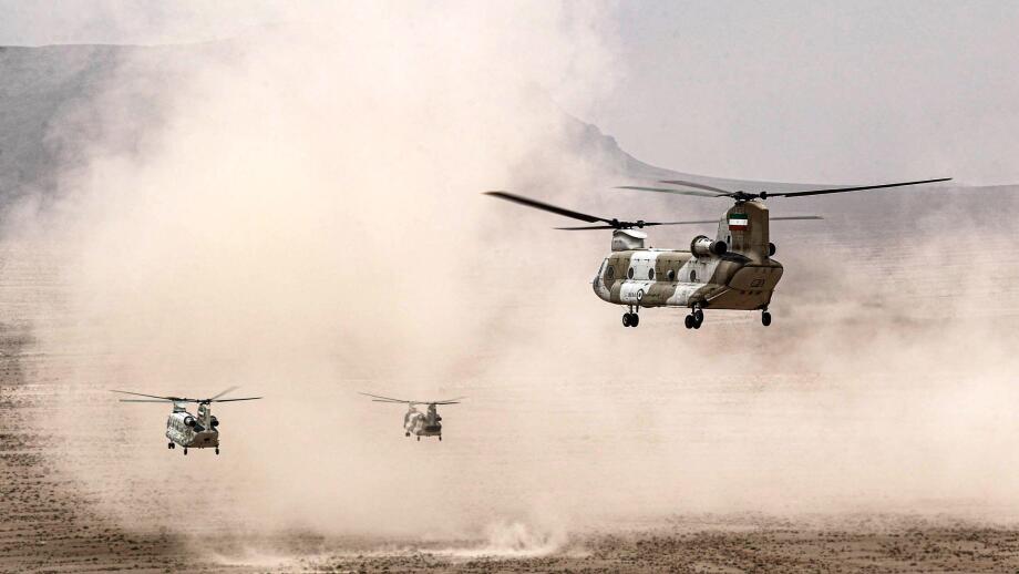 In this photo released by the Iranian army on Saturday, Oct. 28, 2023, helicopters fly during a drill in central Iran. (Iranian Army via AP)
