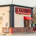 A female customer at Scooter's Coffee Drive-Thru shop on Maple Avenue, Wichita, Kansas, USA.