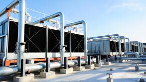 Sets of cooling towers in data center building.