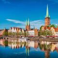 Historic skyline along the Trave river in the old town of Lubeck, Germany on a summer day