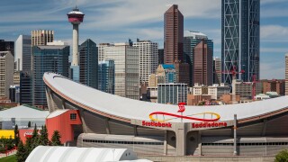 The Scotiabank Saddledome and the city skyline of Calgary, Alberta, Canada
