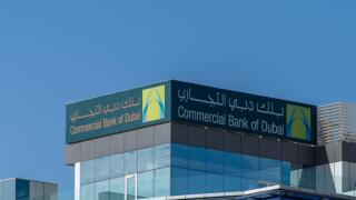 "Ras al Khaimah, Ras al Khaimah/United Arab Emirates - 03/15/2020: "Commercial Bank of Dubai Sign logo on bright blue sky background."